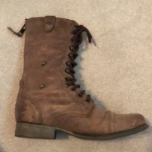 Combat boots with tribal pattern on inside